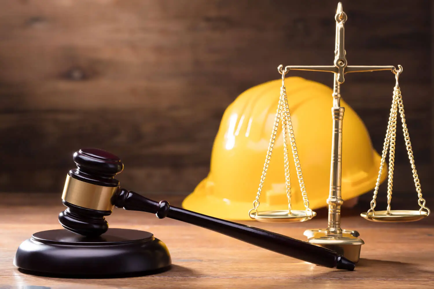 Judge Gavel In Front Of Yellow Safety Helmet