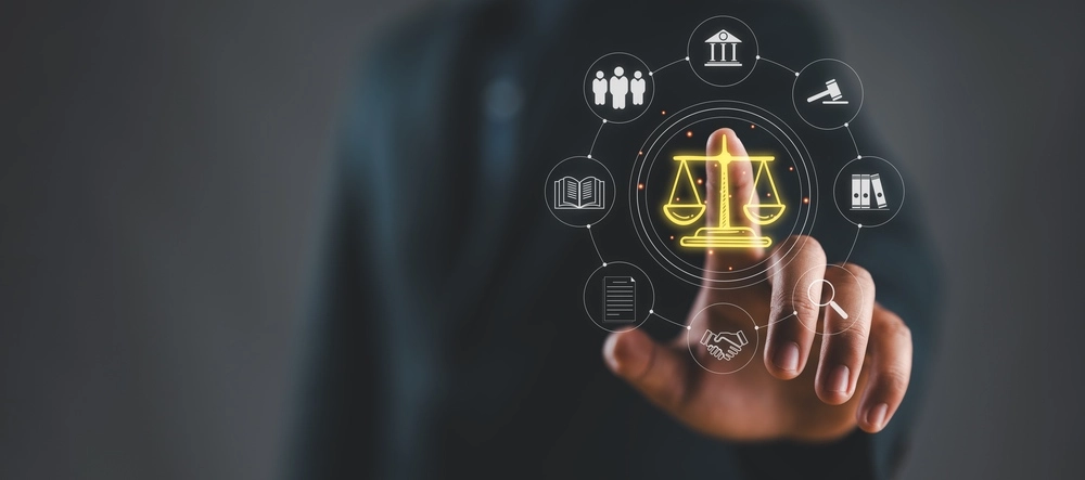 A suited legal professional touches virtual icons symbolizing law, justice, and legal services