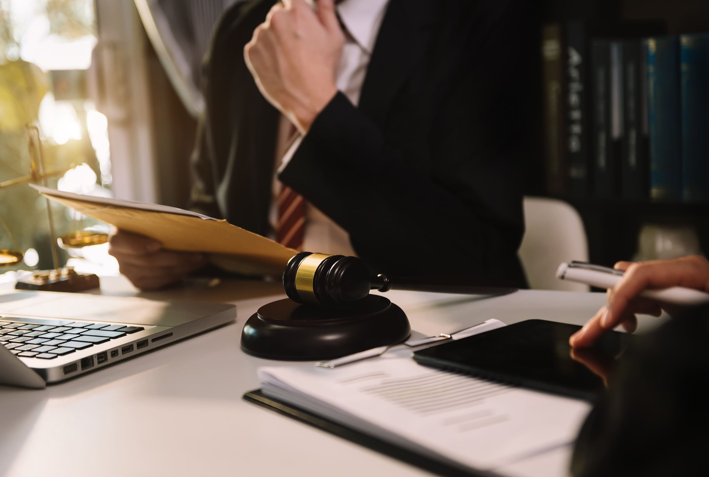 business-meeting-with-laptop-tablet-and-legal-gavel