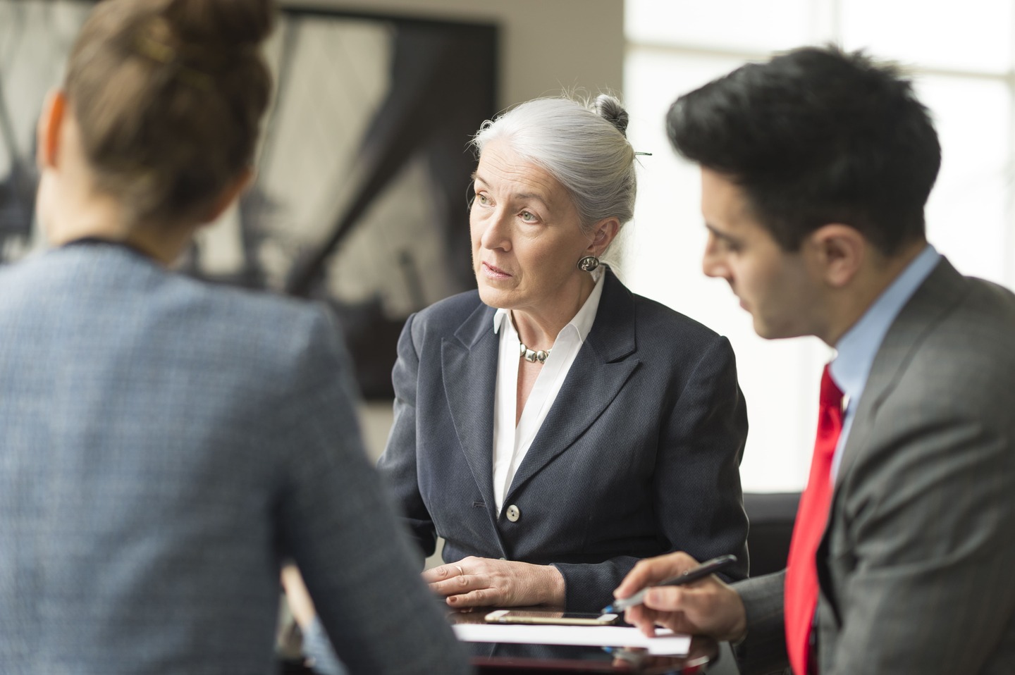 business-meeting-with-professionals-in-office-setting