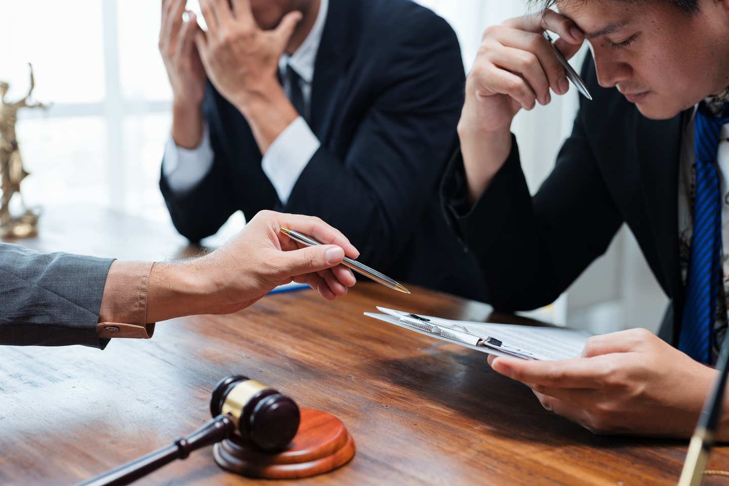 clients-discussing-legal-issues-with-attorney-in-office