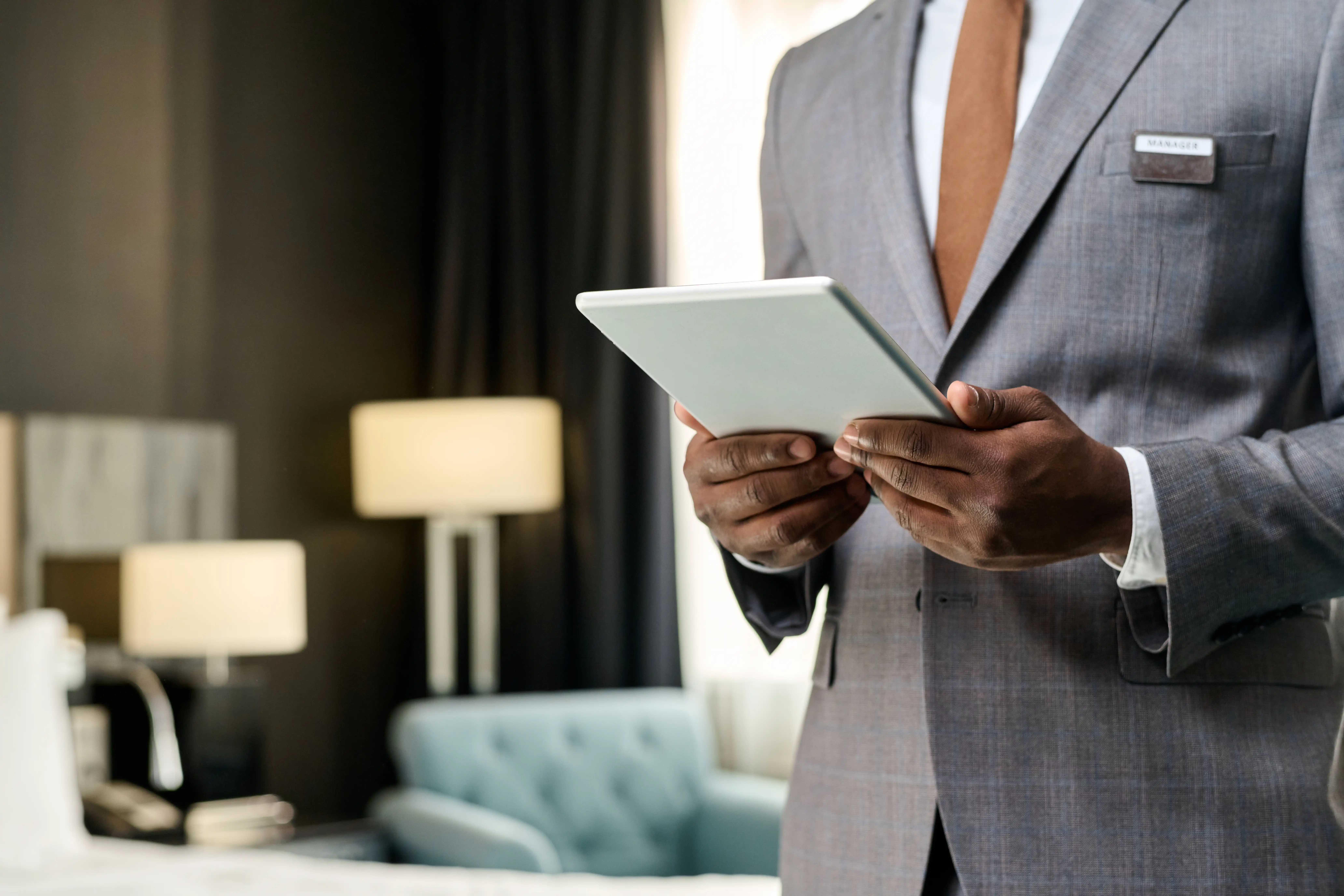 hotel-manager-holding-digital-tablet