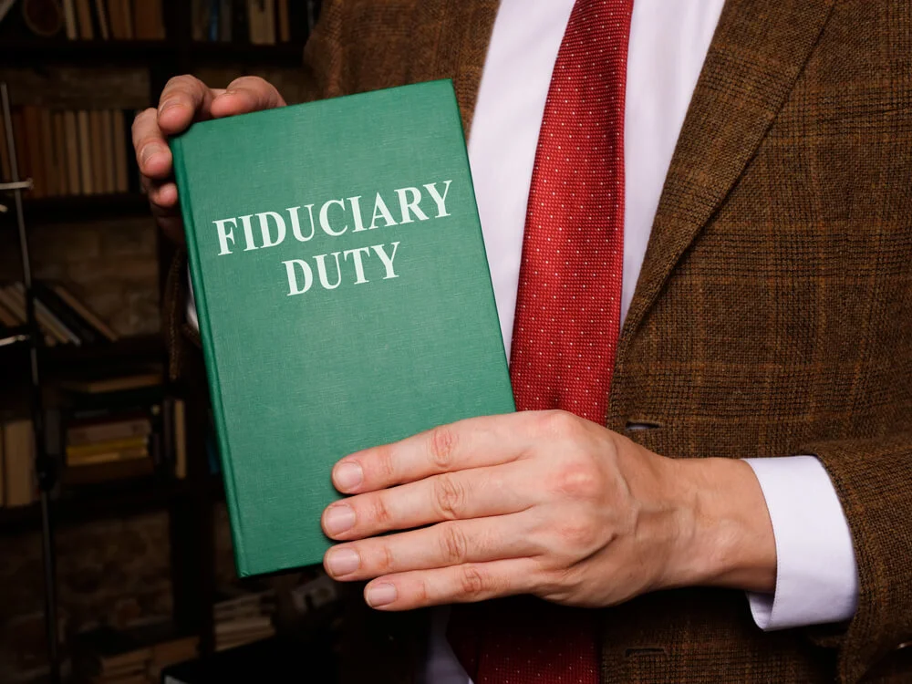 A man shows Fiduciary duty law book