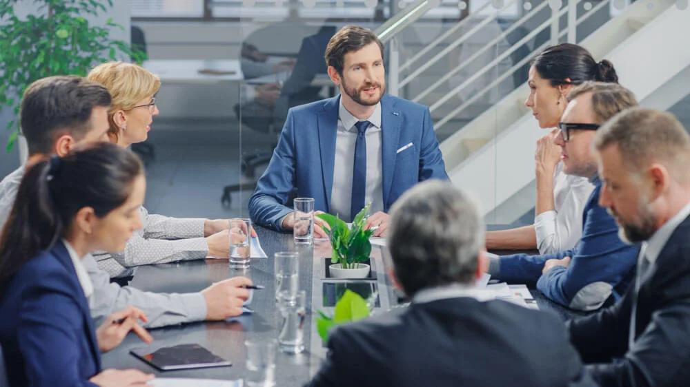 In the Modern Corporate Office Meeting Room: Diverse Group of Businesspeople