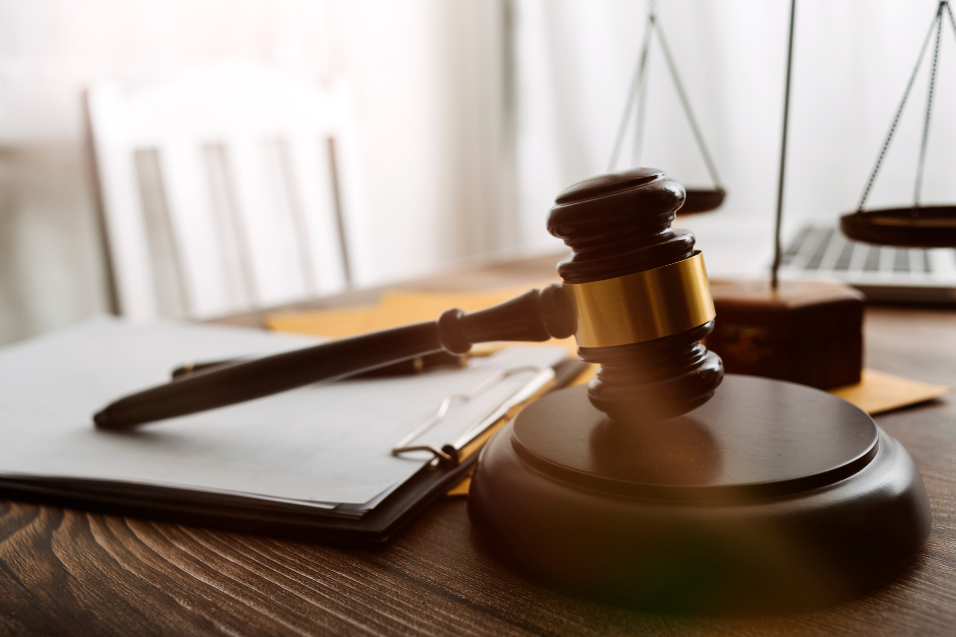 Male judge in a courtroom with the gavel