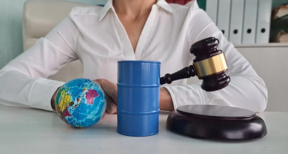 oil barrel with gasoline and globe in court